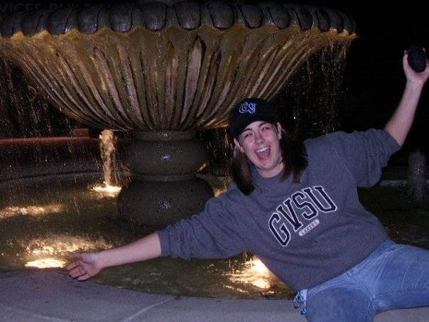 Megan smiling at foundation on campus wearing GVSU gear